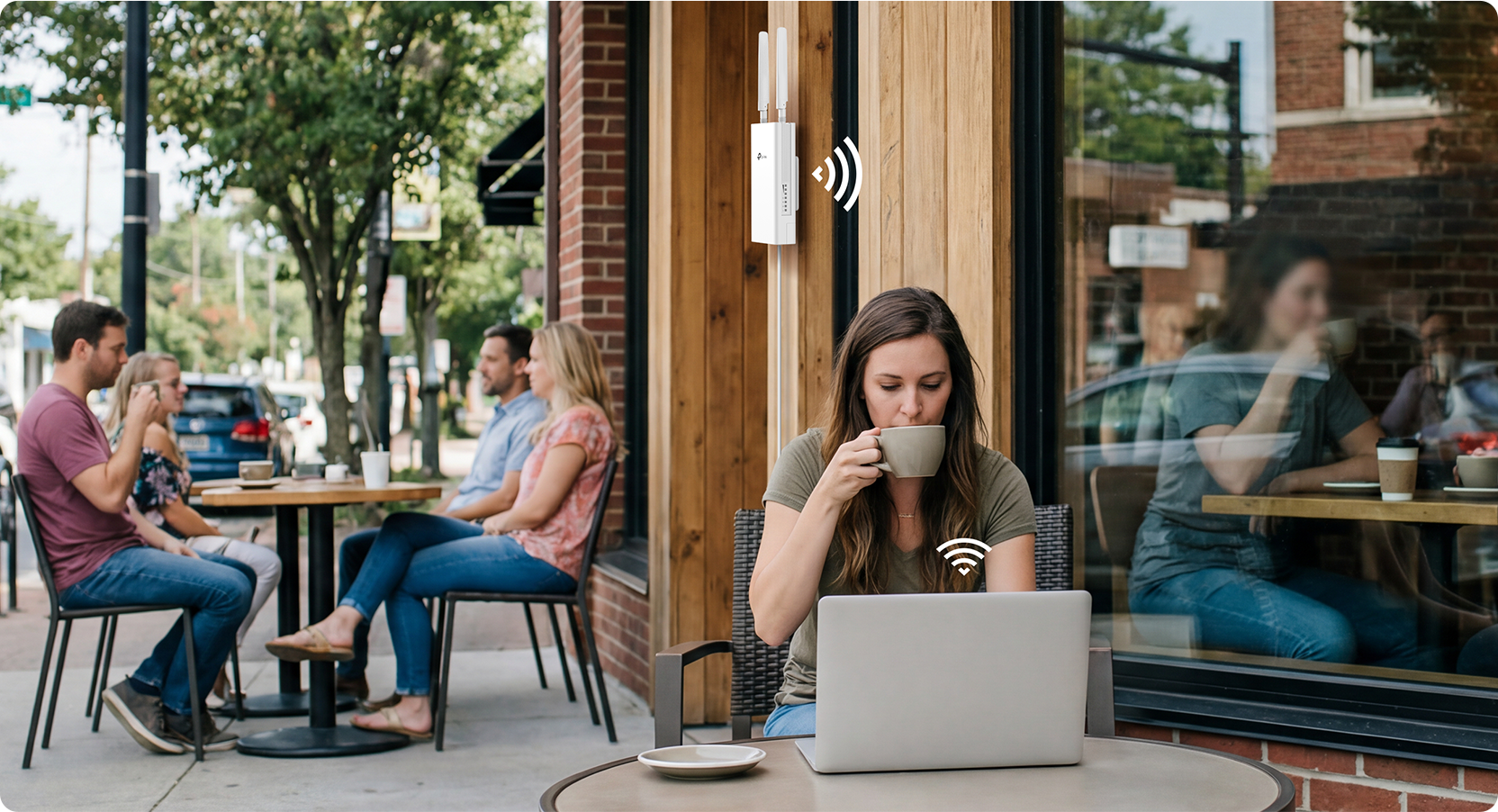 Woman doing work outside of a Café