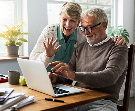 grandparents taking a video call from their laptop