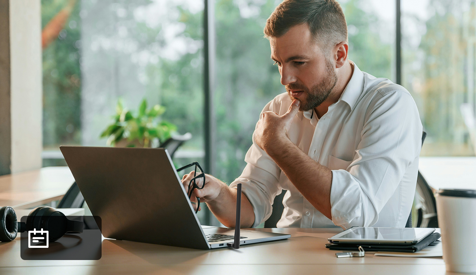 man using a laptop in an office