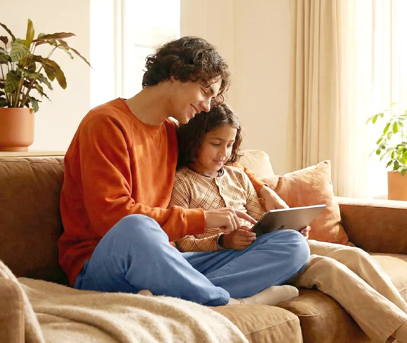 father and daughter using a table together