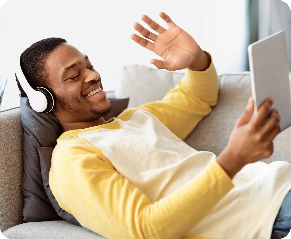 A man relaxing with a tablet