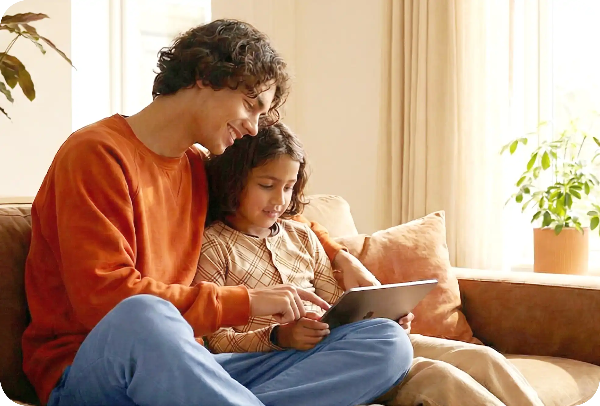 father and daughter using a table together