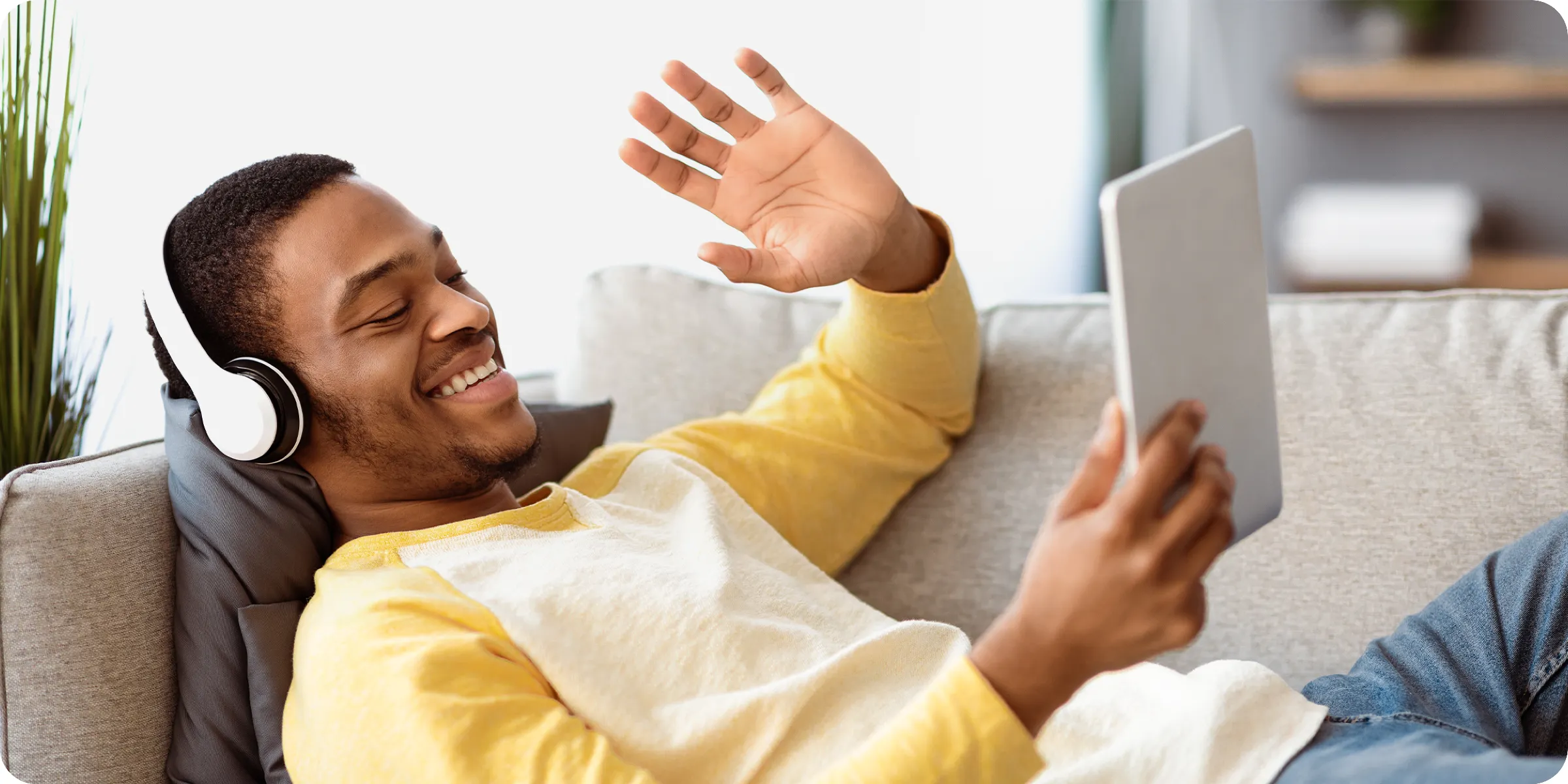 A man relaxing with a tablet