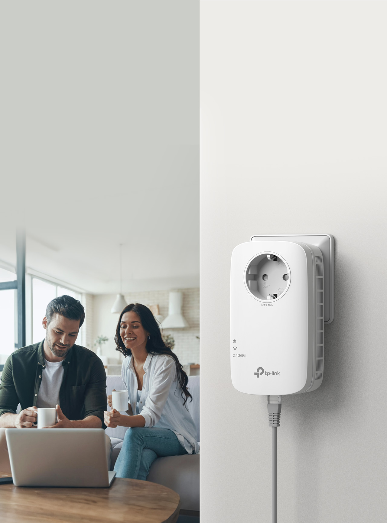 RE600X Wi-Fi 6 range extender with passthrough outlet beside a couple using a laptop at home.
