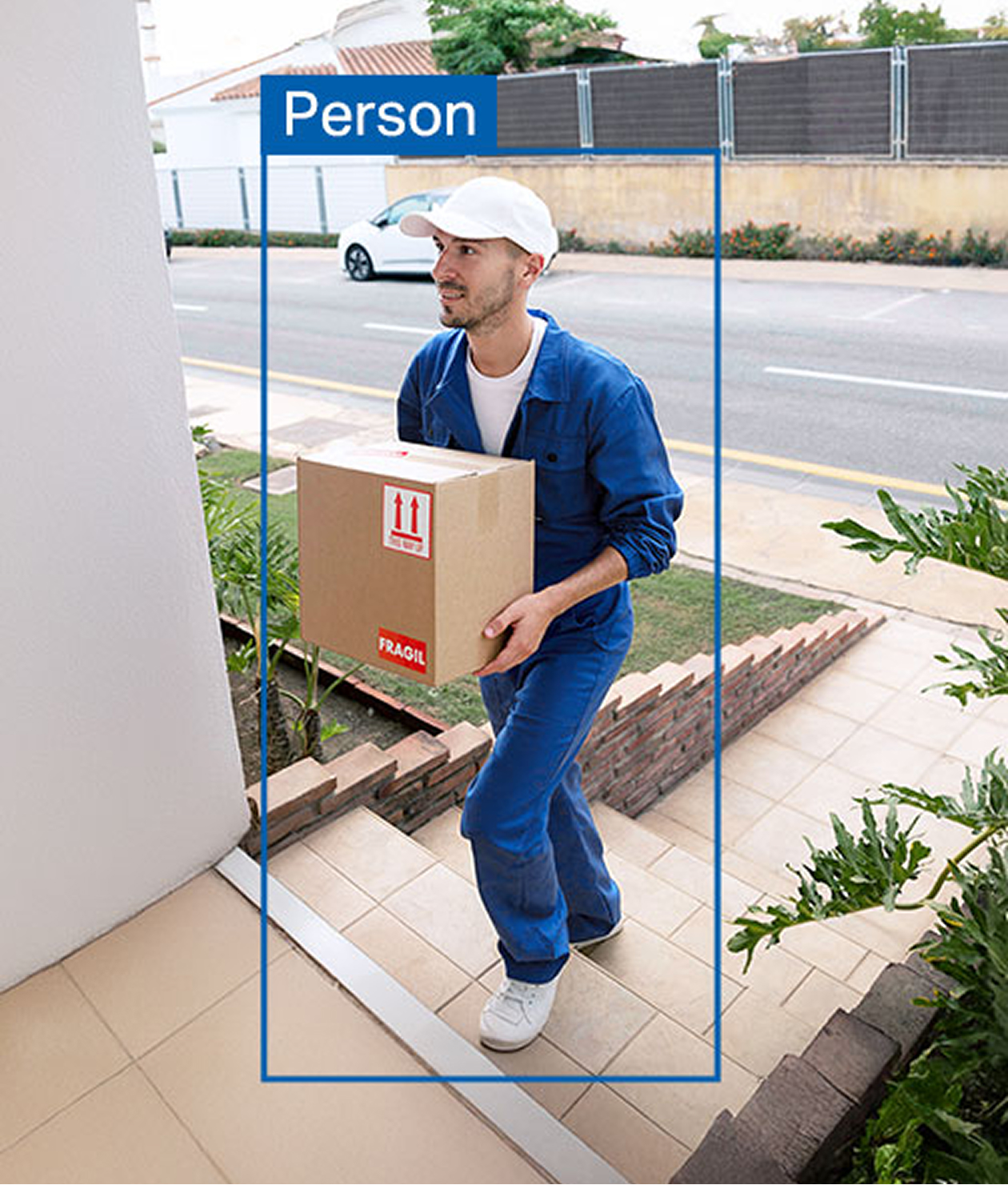 Delivery driver holding a package