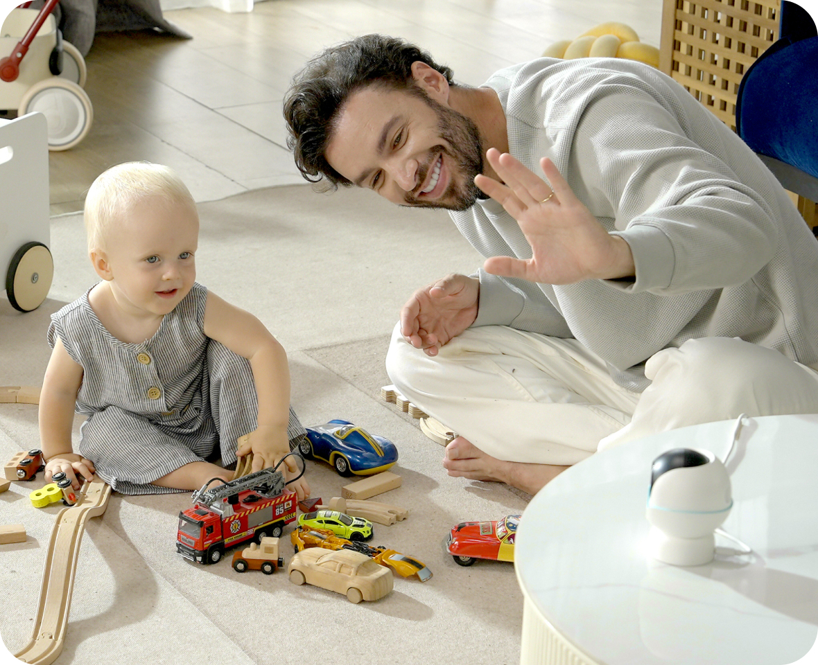 Parent using two-way audio with a baby.