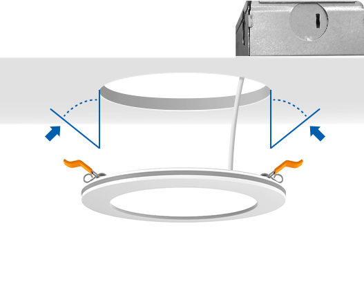 Push spring-loaded clips on the light upwards and insert the fixture base into the mounting hole.