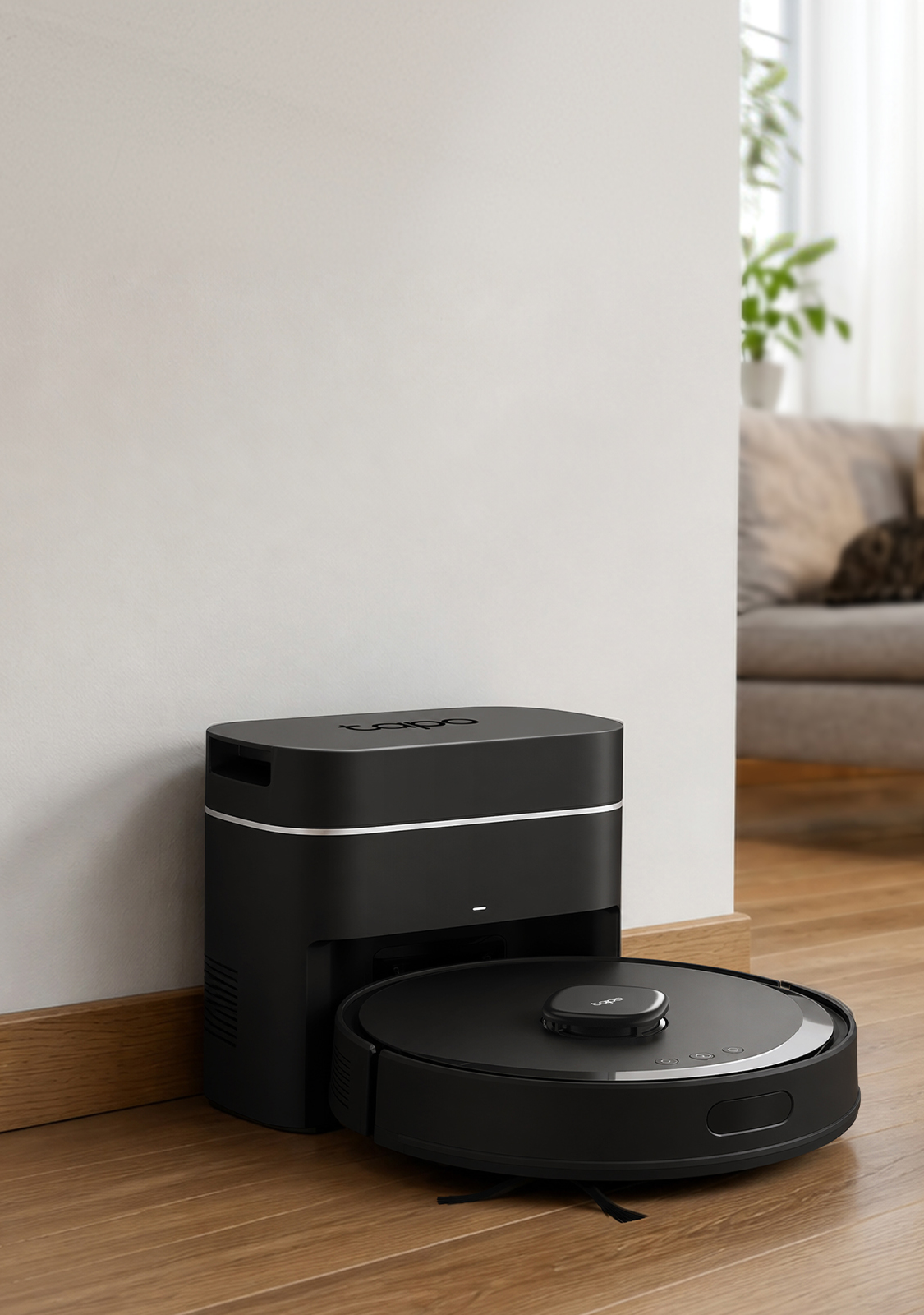 Tapo RV30 Max Plus Gen 2 robot vacuum and auto-empty dock in a living room